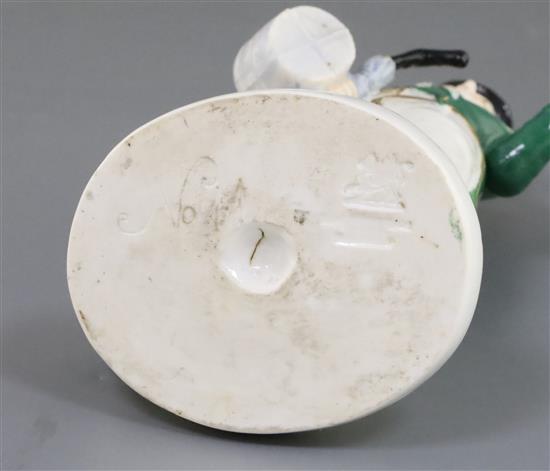 A Rockingham porcelain figure of John Liston as Lubin Log, c.1830, H.17cm, restoration to umbrella handle and left hand